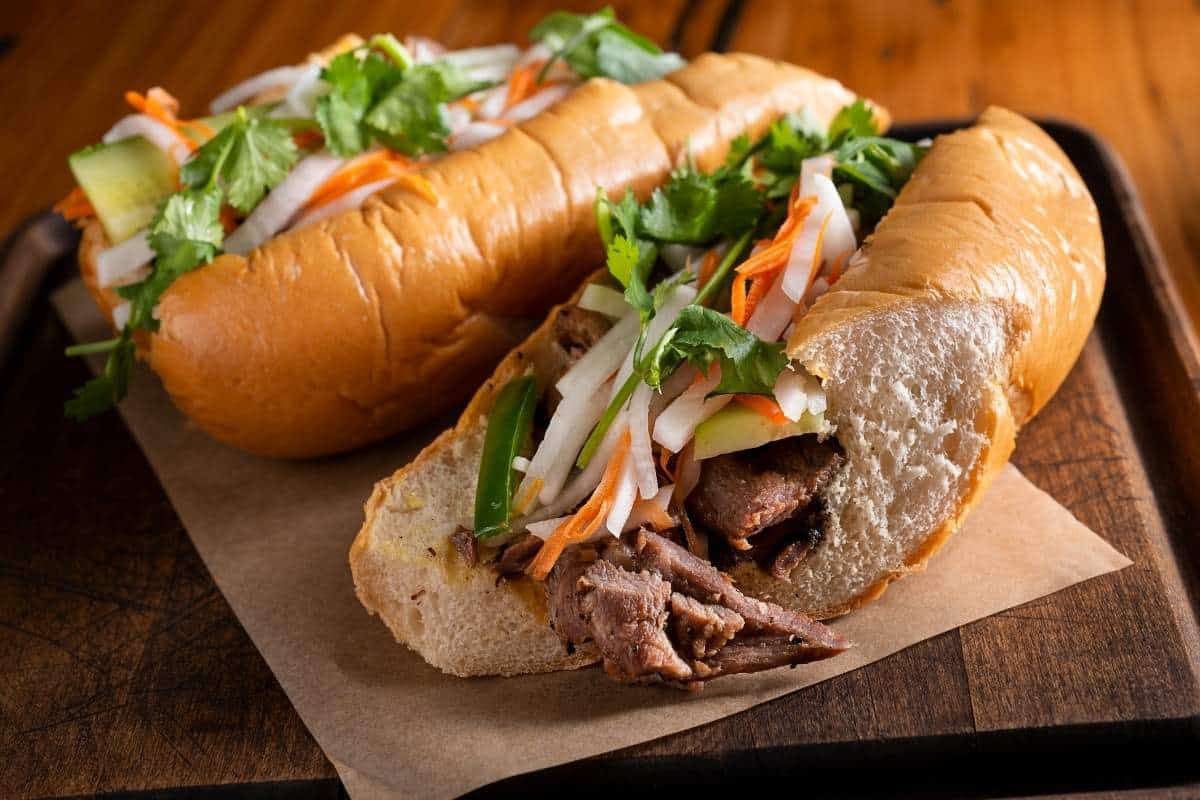 Closeup of a Vietnamese Banh Mi Sandwich on a wooden background