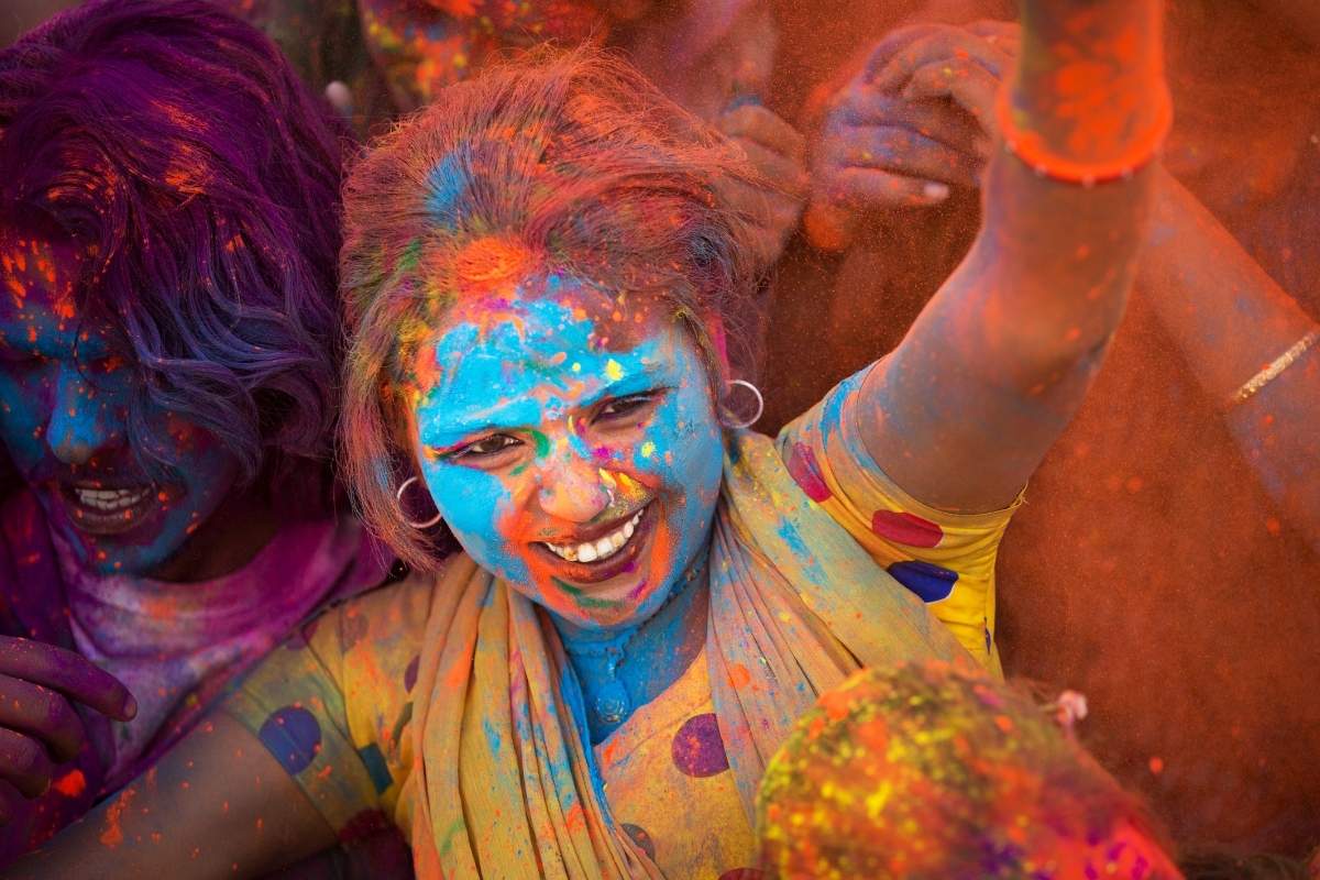 Facts about Indian - Young people dancing during the Spring Holi festival in India