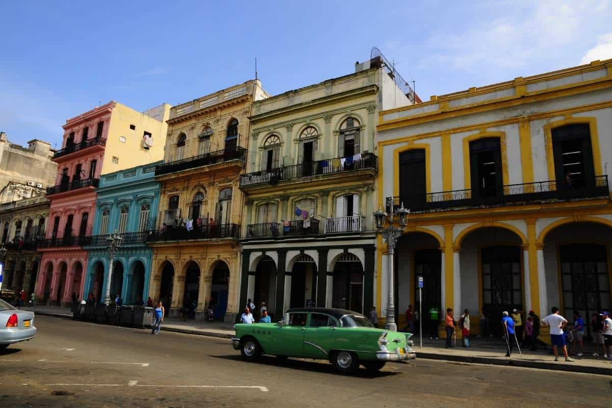 Multicolored concrete buildings under a blue sky in Havana, Cuba