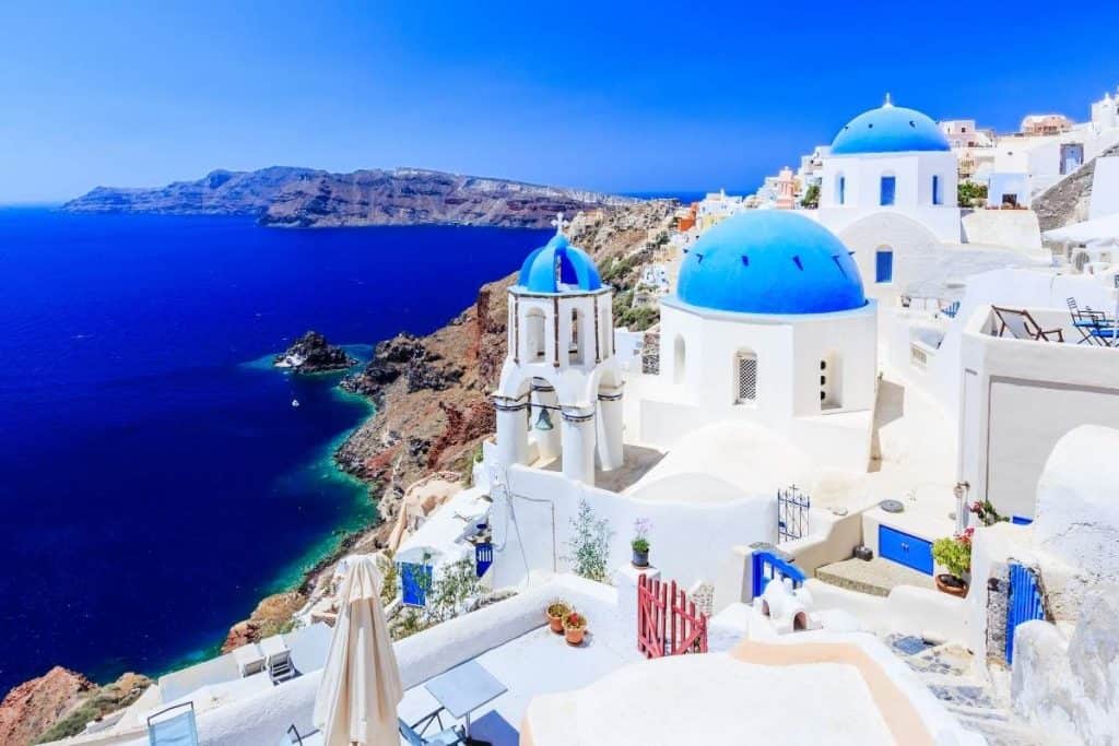 Blue water and blue rooftops with an ocean view in Santorini, Greece