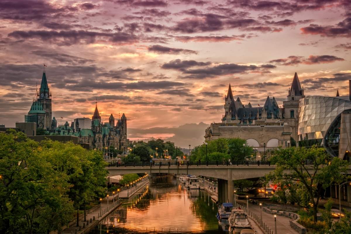 Fun facts about Canada: Rideau Canal in Ottawa at sunset with Canadian Parliament building in the background