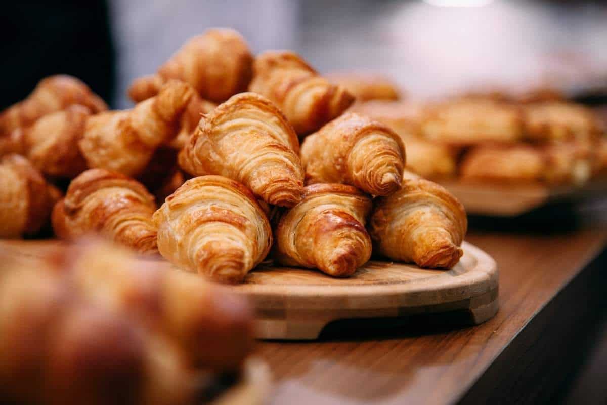 Rows of fresh baked croissants ready to be sold in a Parisian Boulangerie