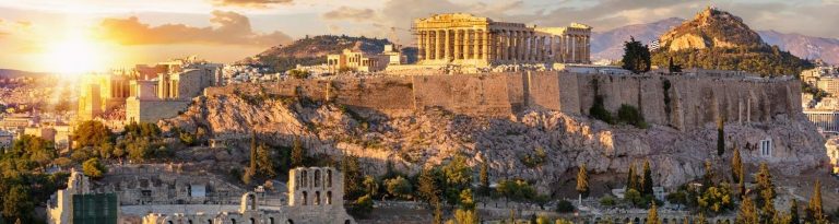 The Acropolis of Athens, Greece, with the Parthenon Temple on top of the hill during sunset