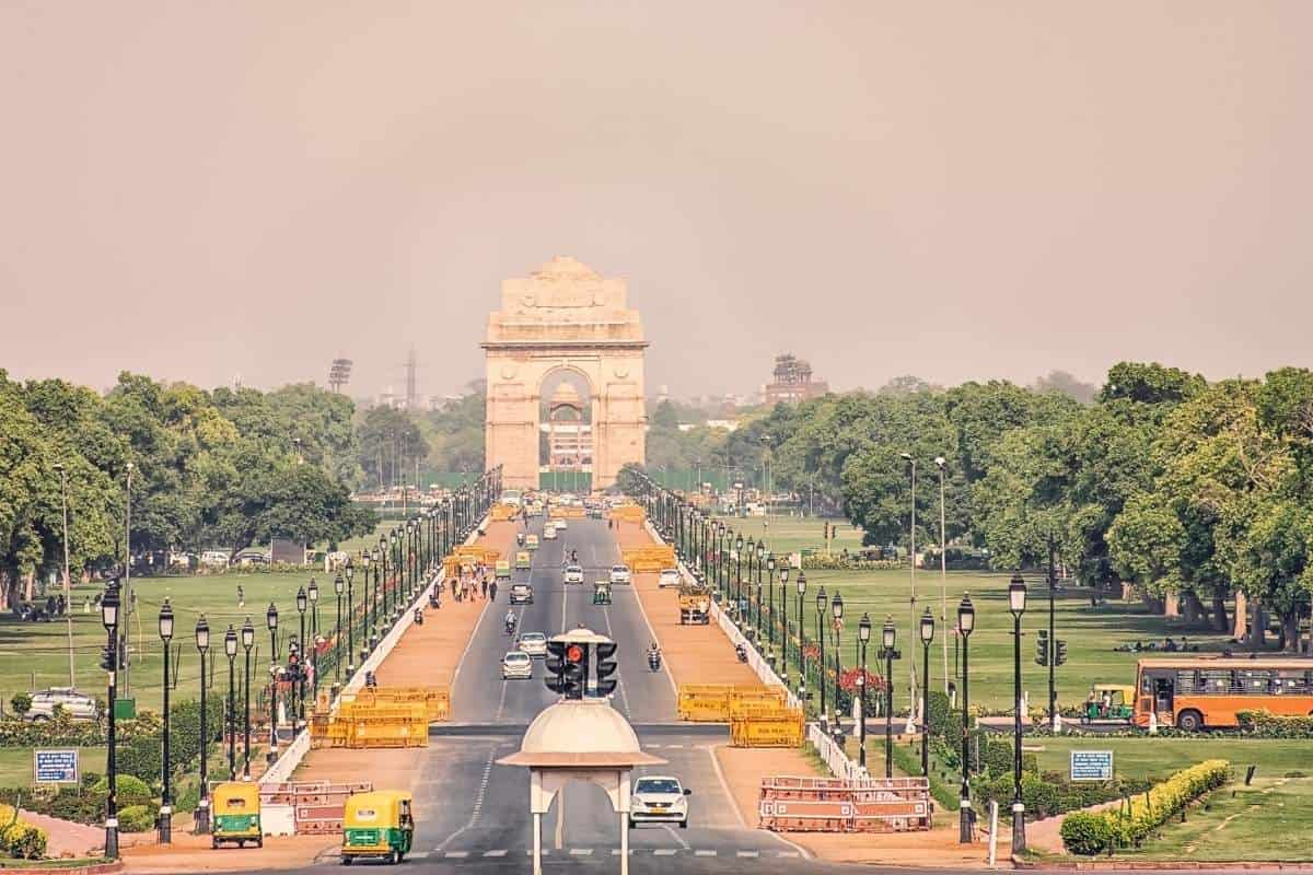 The India Gate war memorial in New Delhi, India during day time with a smog sky backdrop