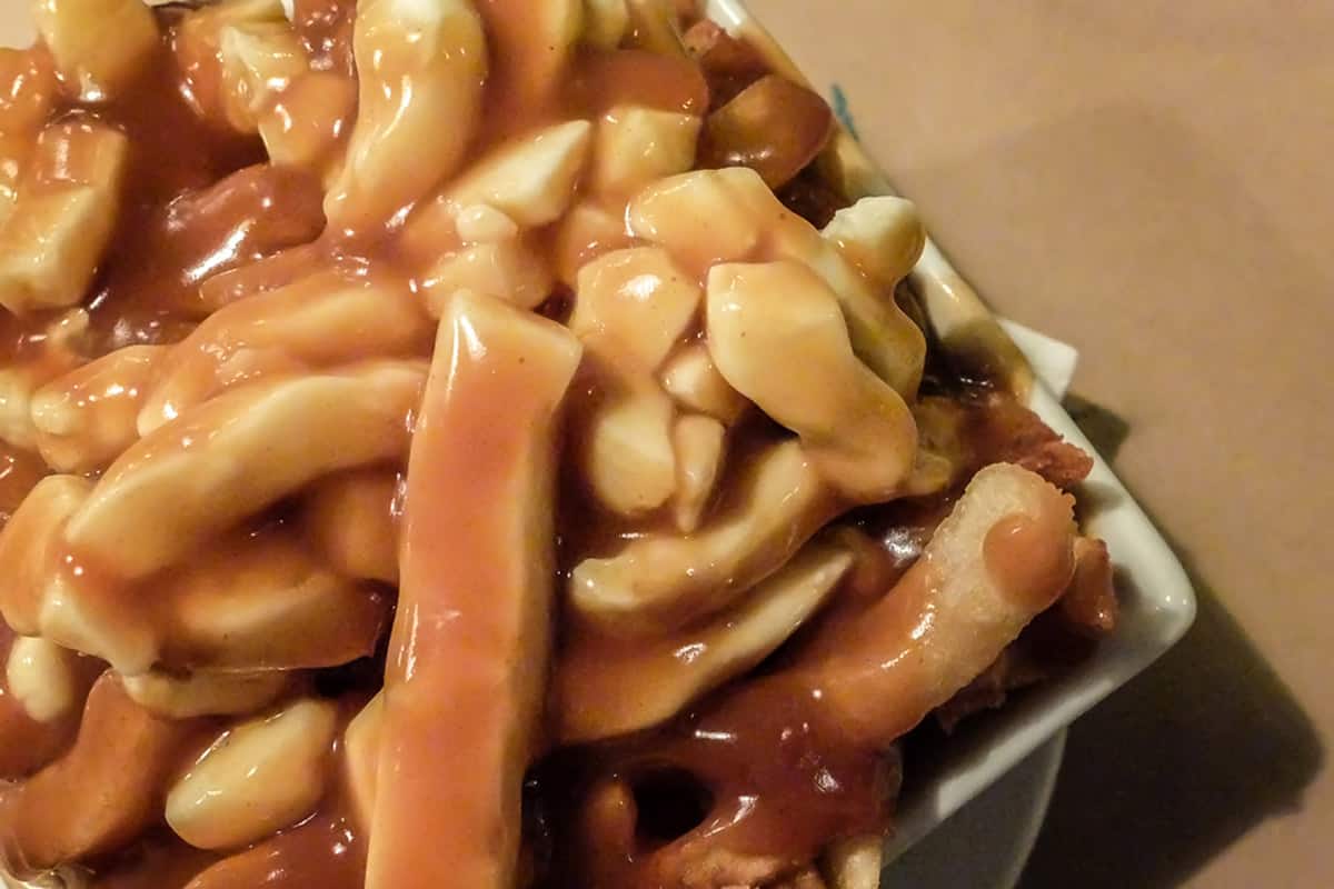 A dish of poutine - french fries, cheese curds and gravy