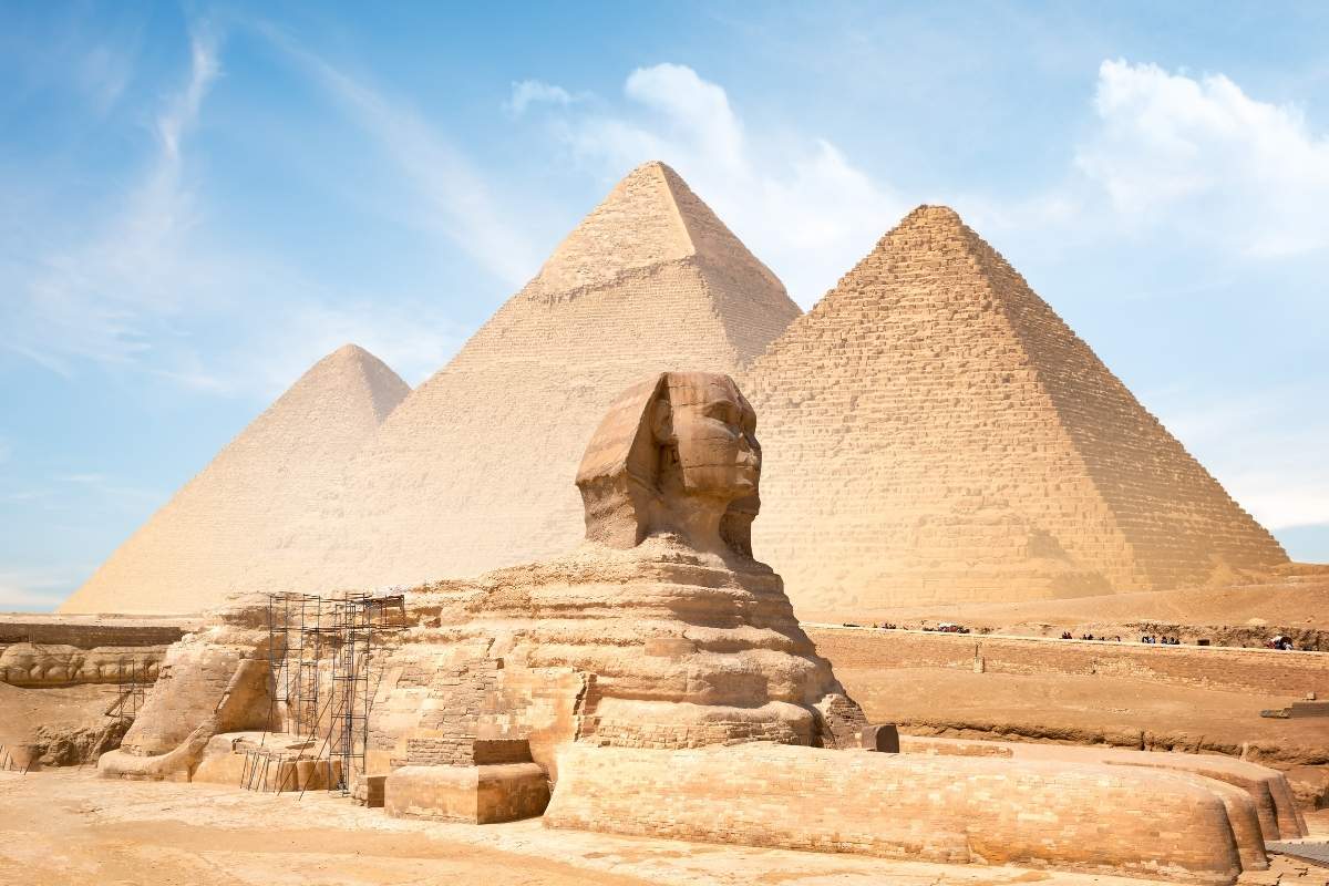 Great sphinx and pyramids of Giza, Egypt under a bright sun 