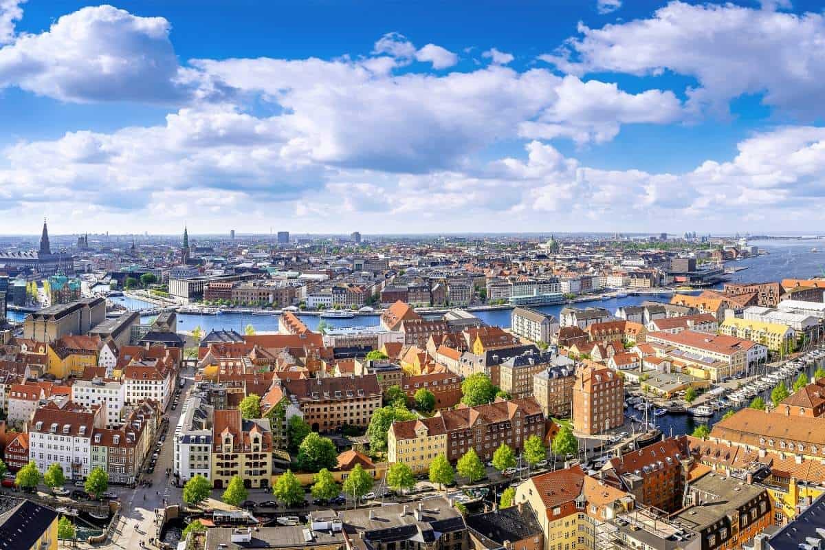 Aerial image of Copenhagen, the capital of Denmark on a sunny day with a blue sky and white clouds 