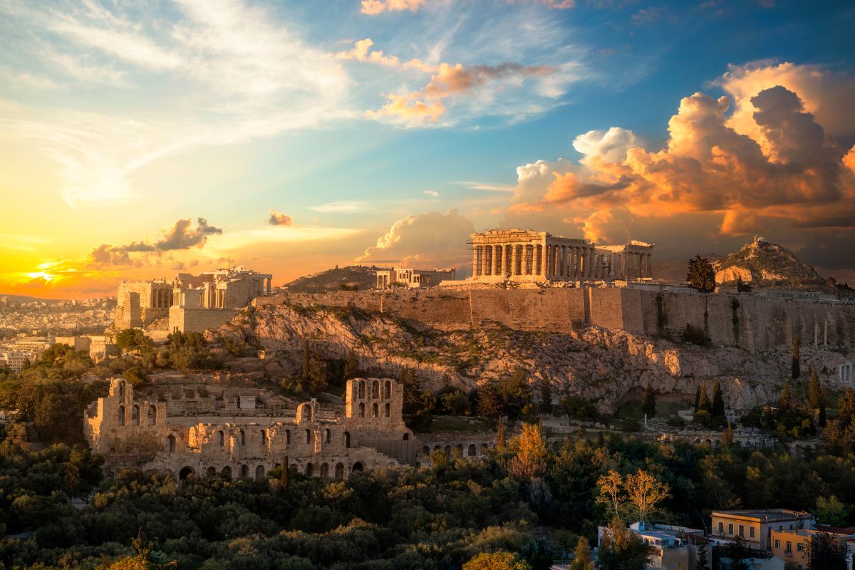 Dramatic sky over the structures in the Acropolis of Athens at sunset