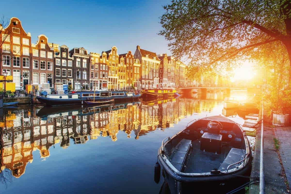 Amsterdam canal at sunset - famous landmarks in Europe.