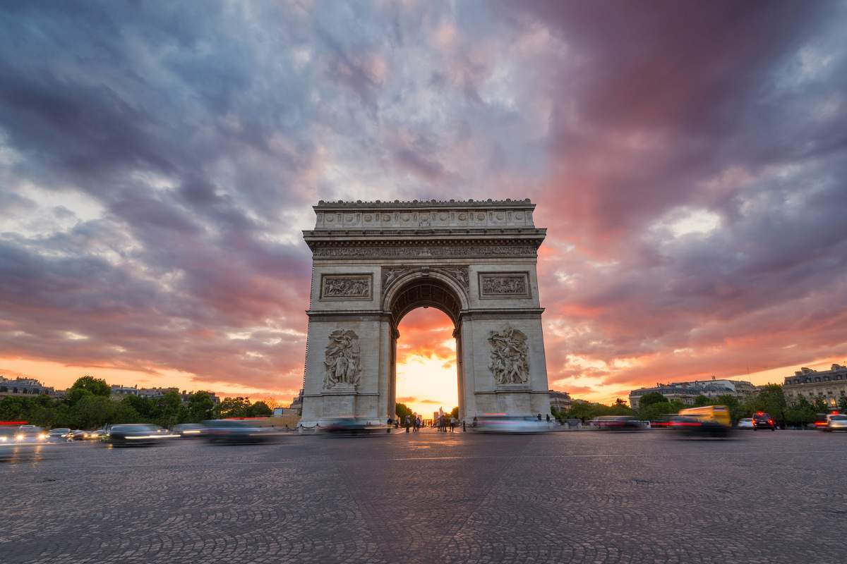 Arc de Triomphe and traffic along the Champs-Elysees at sunset 