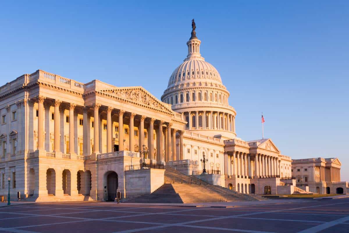 Rising sun illuminates the front of the Capitol building in Washington, D.C.