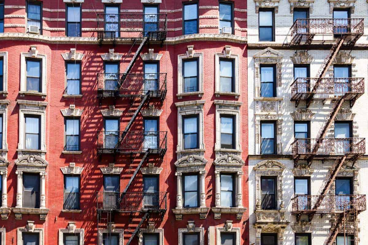 View of fire escapes and windows on the side of a downtown New York City building